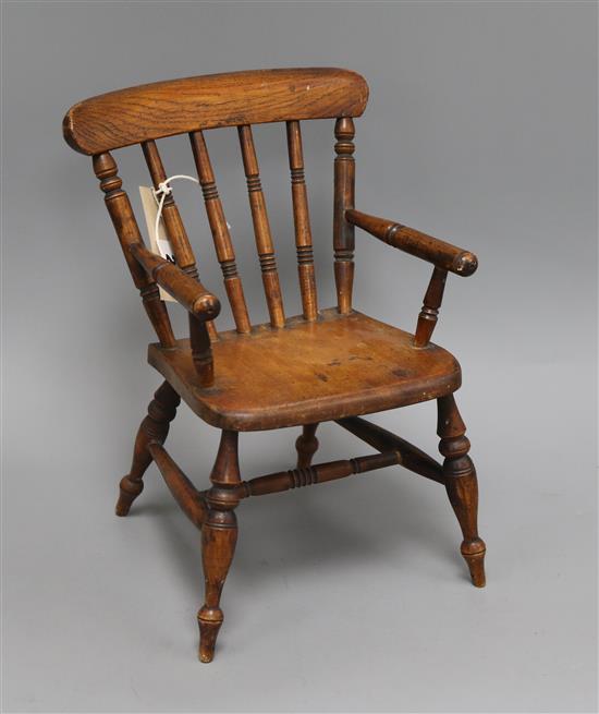 A Victorian ash and beech miniature wood-seat armchair